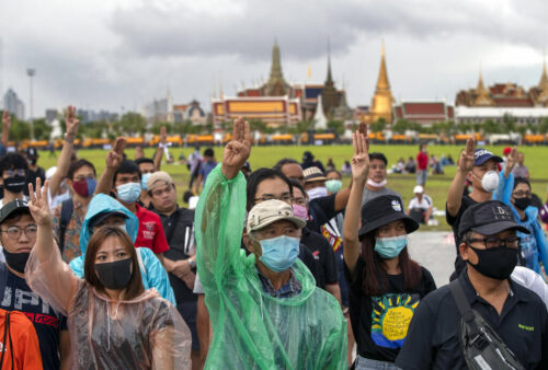 Pro-democracy protesters raise a three-finger salute during a rally at Sanam Luang on Sept. 20, 2020. Photo: Gemunu Amarasinghe / AP