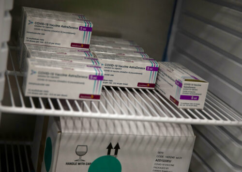 Boxes of the AstraZeneca COVID-19 vaccine are stored in a refrigerator at the Vaccine Village in Antwerp, Belgium on Tuesday, March 16, 2021. Photo: Virginia Mayo / AP