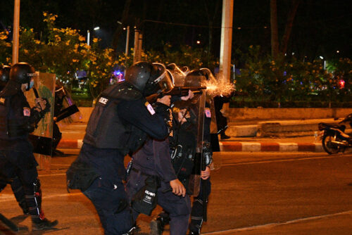 A riot police fires rubber bullets at anti-government demonstrators on Feb. 28, 2021.