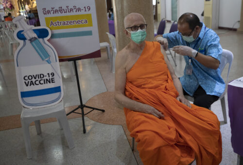 A health worker administers a dose of the AstraZeneca COVID-19 vaccine to a Buddhist monk at Nak Prok Temple in Bangkok, Thailand, Friday, April 9, 2021. Photo: Sakchai Lalit / AP