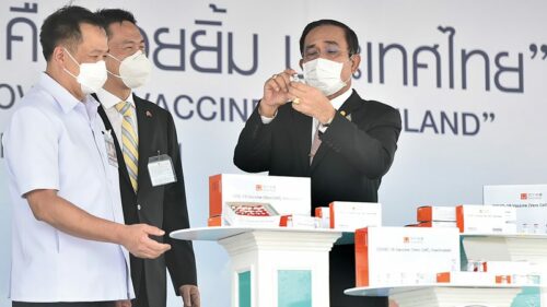 PM Prayut Chan-o-cha holds a vial during the welcoming ceremony for Sinovac vaccines at Suvarnabhumi Airport on Feb. 24, 2021.